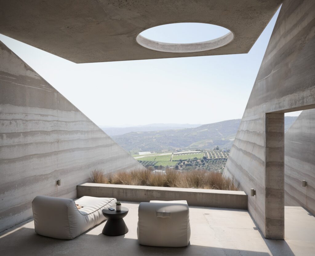Open courtyard with circular skylight at N'Arrow residence in Crete